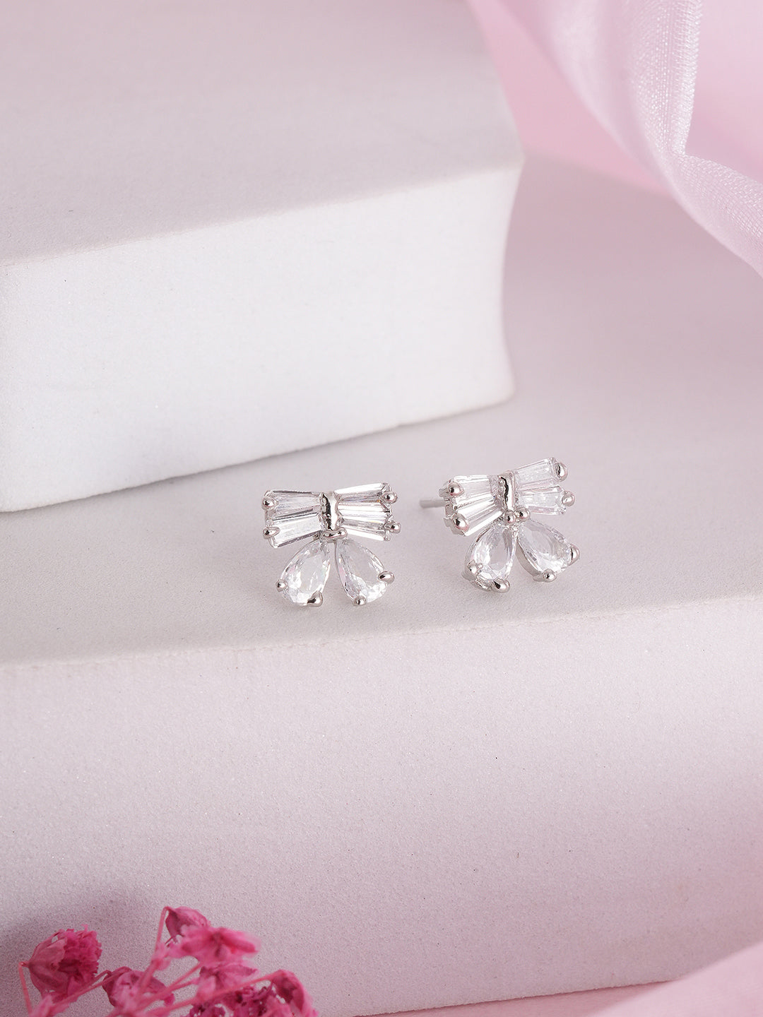 Jazz And Sizzle Silver Plated American Diamond Studded Bow Shaped Contemporary Studs