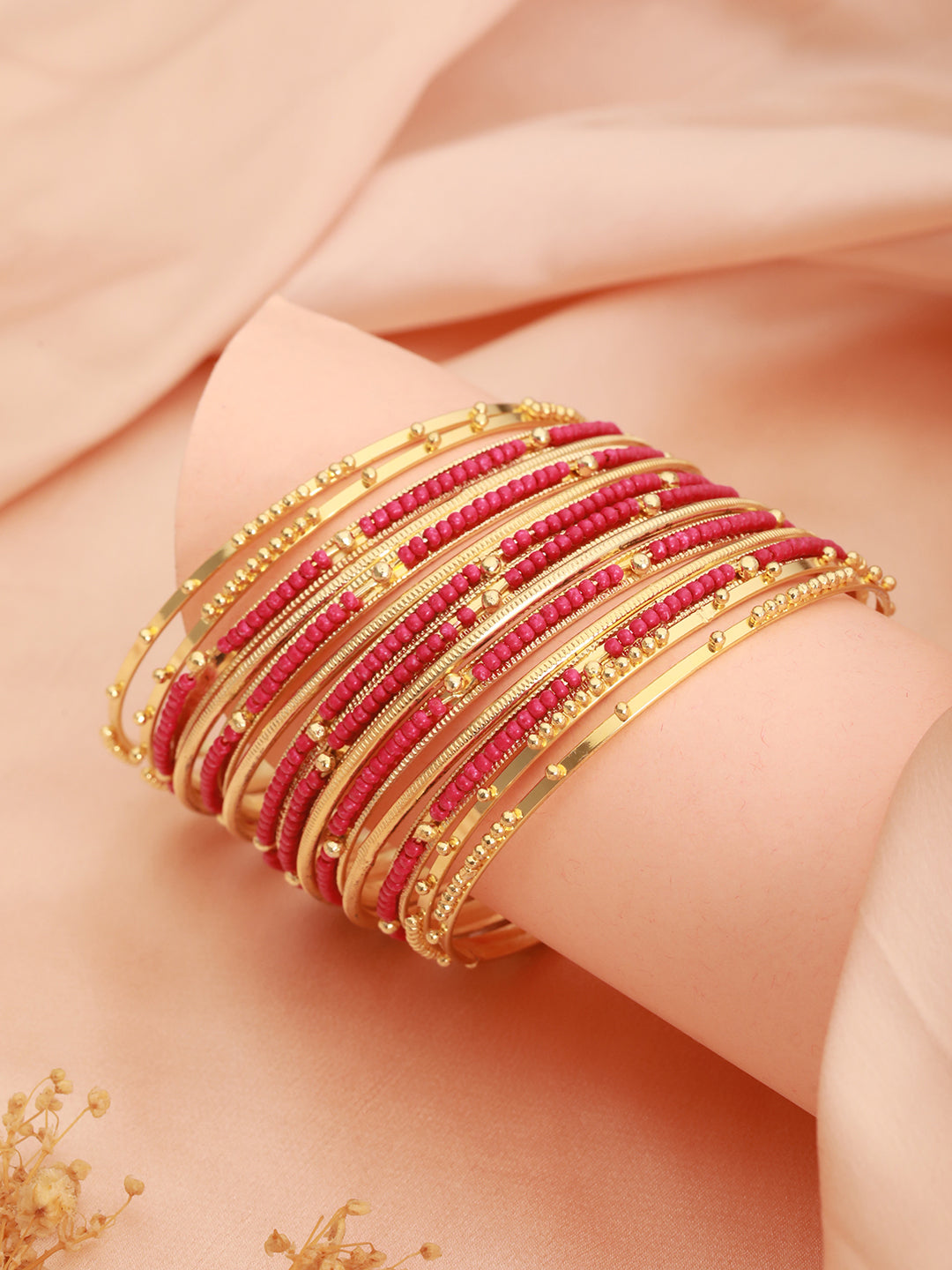 Jazz And Sizzle Set Of 12 Gold-Plated Artificial Stone-Studded & Beaded Hot Pink Bangles