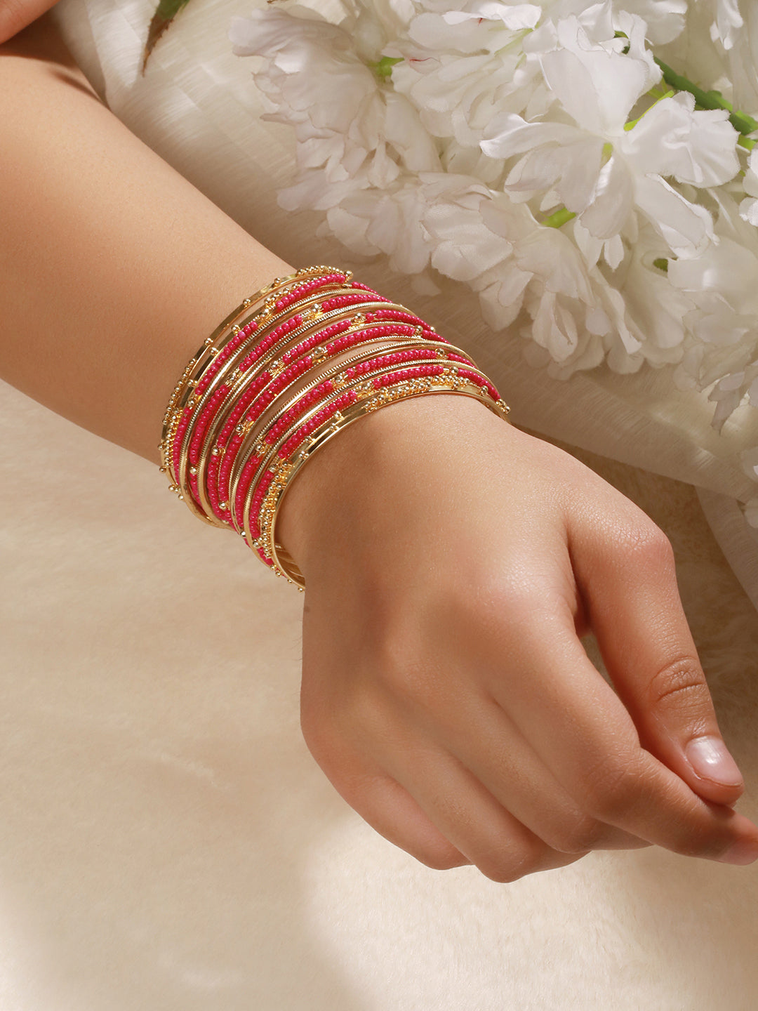 Jazz And Sizzle Set Of 12 Gold-Plated Artificial Stone-Studded & Beaded Hot Pink Bangles