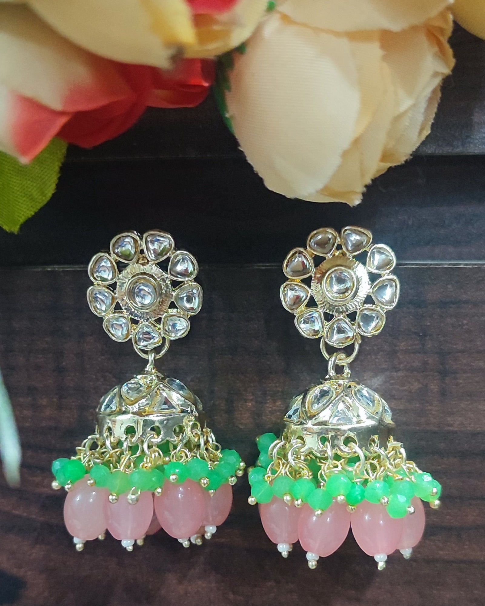 Jazz And Sizzle Gold Plated Pink &Green Pearl Beaded Kundan Studded Jhumka Earrings