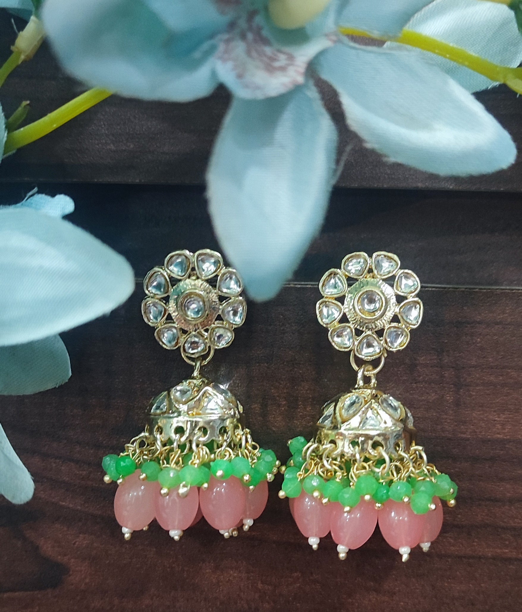 Jazz And Sizzle Gold Plated Pink &Green Pearl Beaded Kundan Studded Jhumka Earrings
