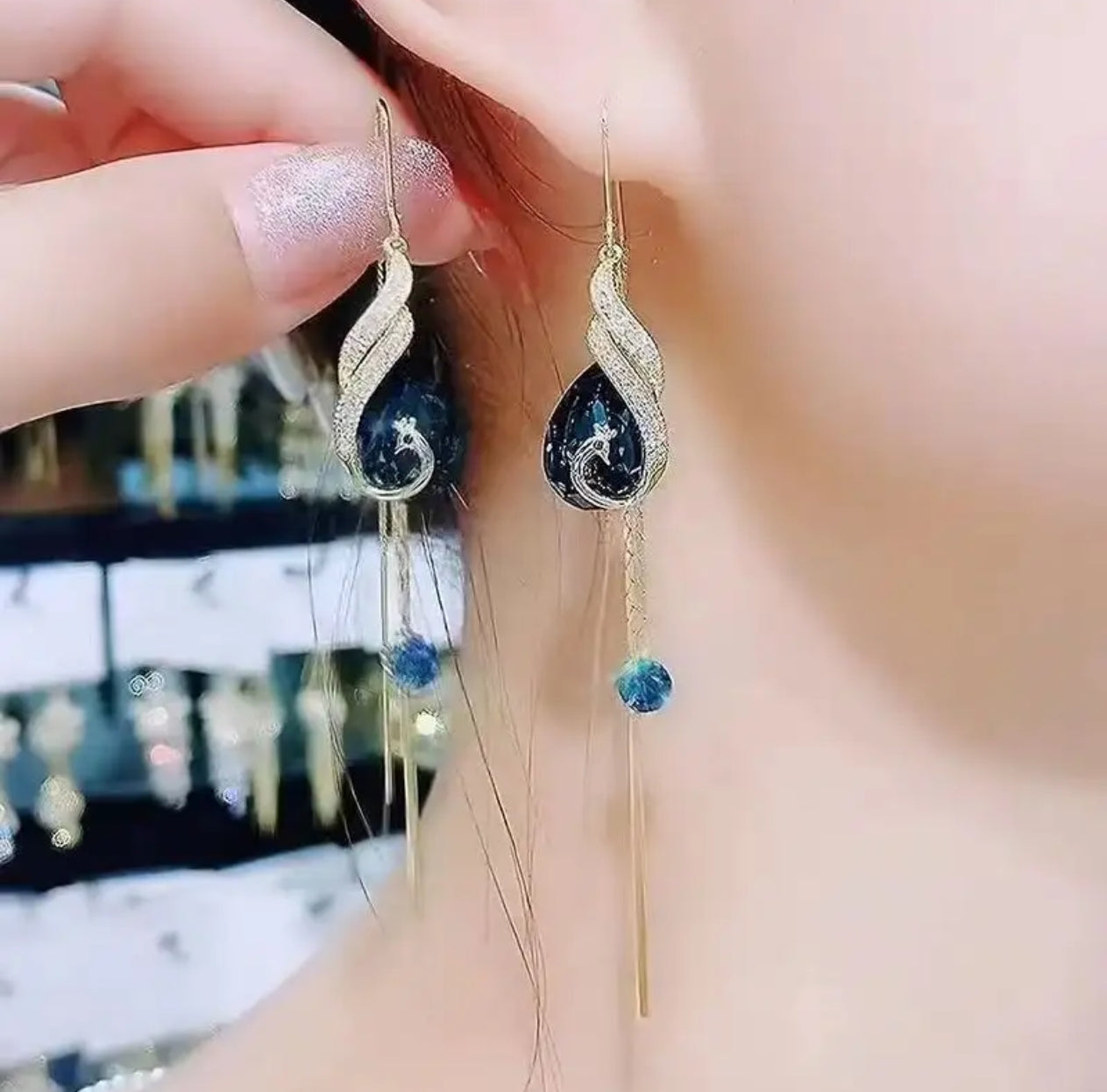 Jazz And Sizzle Gold Plated and Blue Stone Studded Long Danglers Earrings