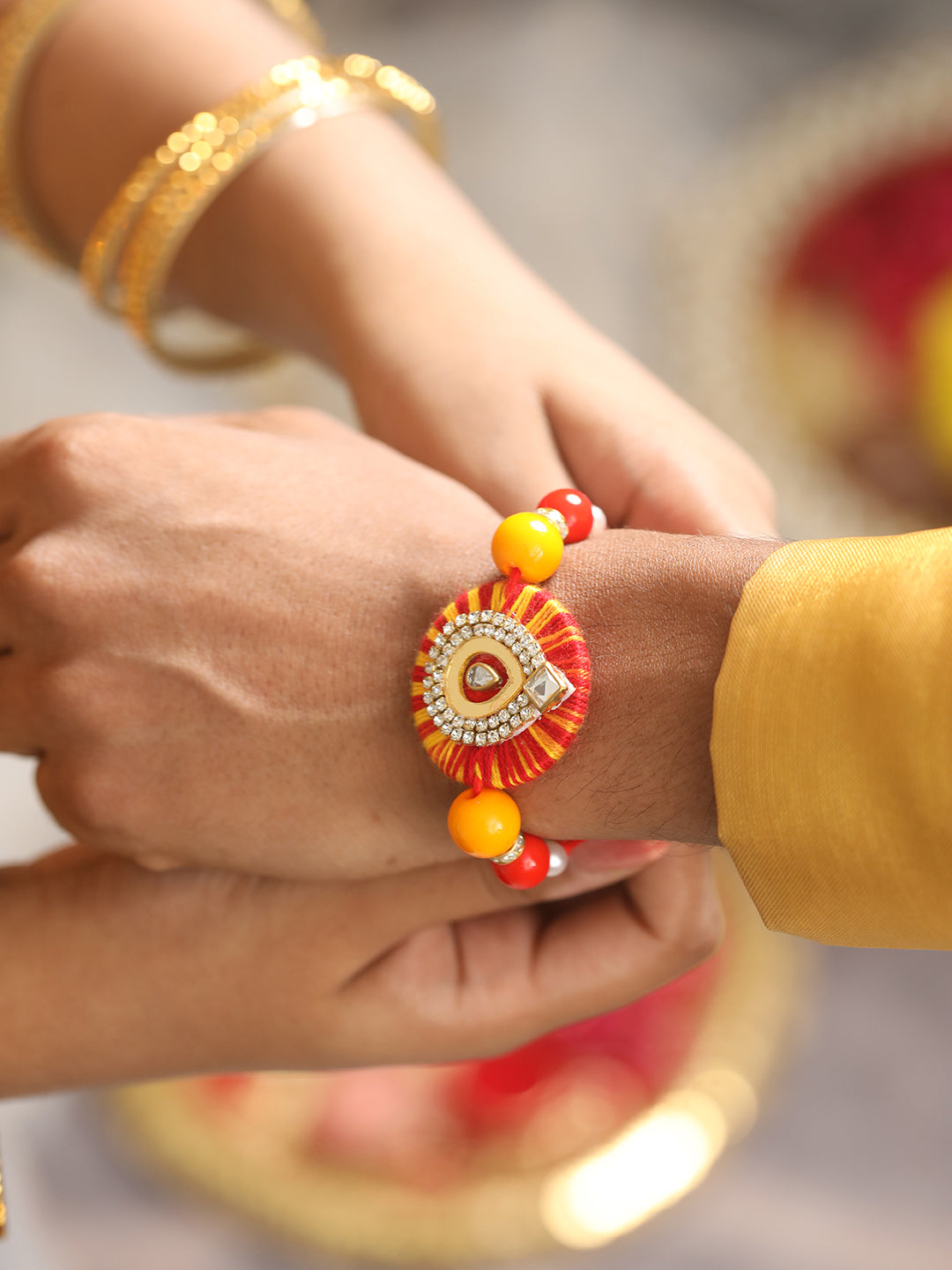Jazz And Sizzle Set Of 2 Round Shaped Orange Kundan & Pearl Beaded Bhaiya Bhabhi Rakhi