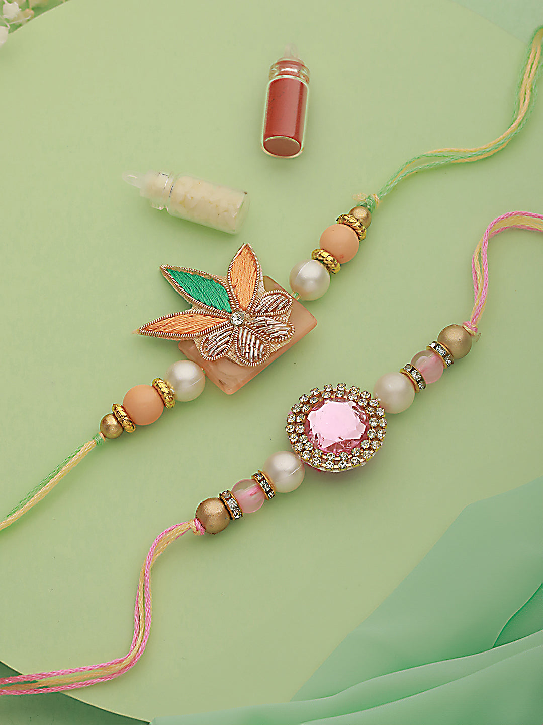 Jazz And Sizzle Unisex Set Of 2 Stone Studded & Floral Rakhi With Roli & Chawal