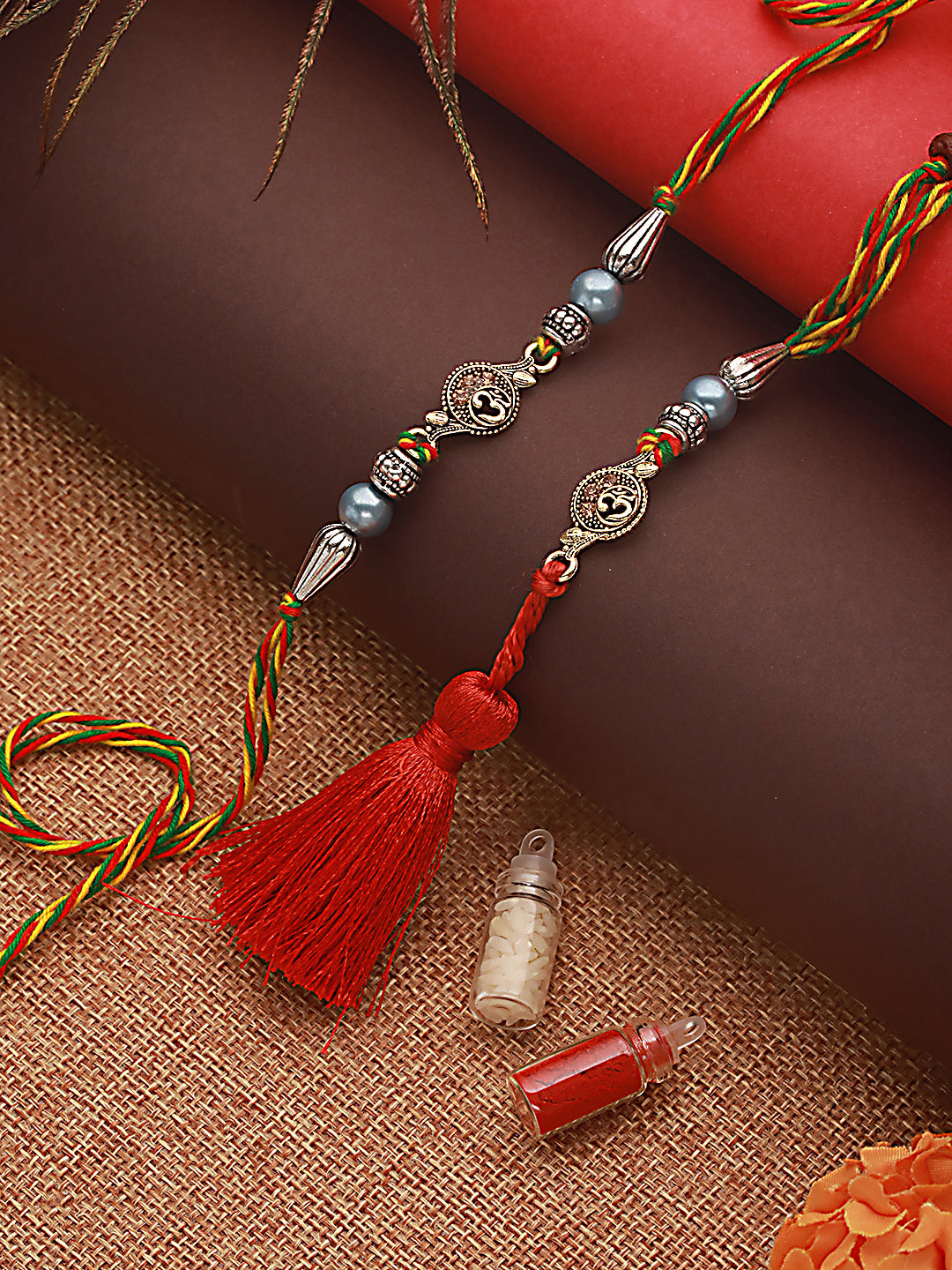 Jazz And Sizzle Set Of 2 Om & Pearl Beaded Bhaiya Bhabhi Tasseled Rakhi