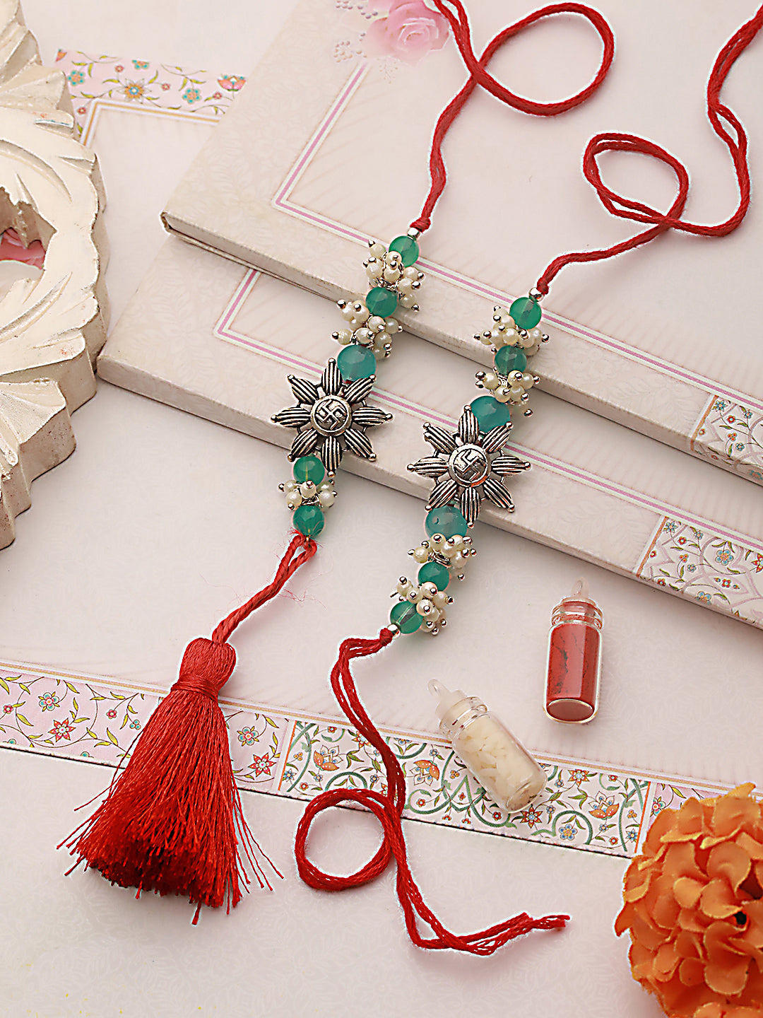 Jazz and Sizzle Set Of 2 Swastik Motif & Mogra Beaded Bhaiya Bhabhi Tasseled Rakhi