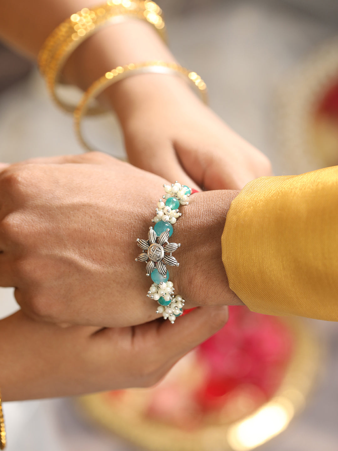 Jazz and Sizzle Set Of 2 Swastik Motif & Mogra Beaded Bhaiya Bhabhi Tasseled Rakhi