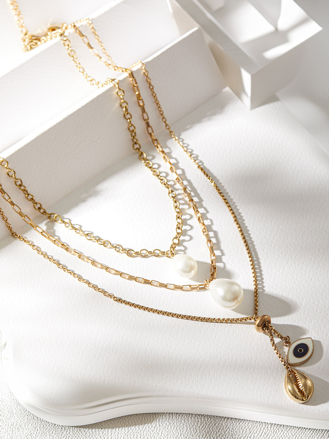 Gold-Plated Layered Pearl Chain Necklace with Evil Eye & Shell Charms