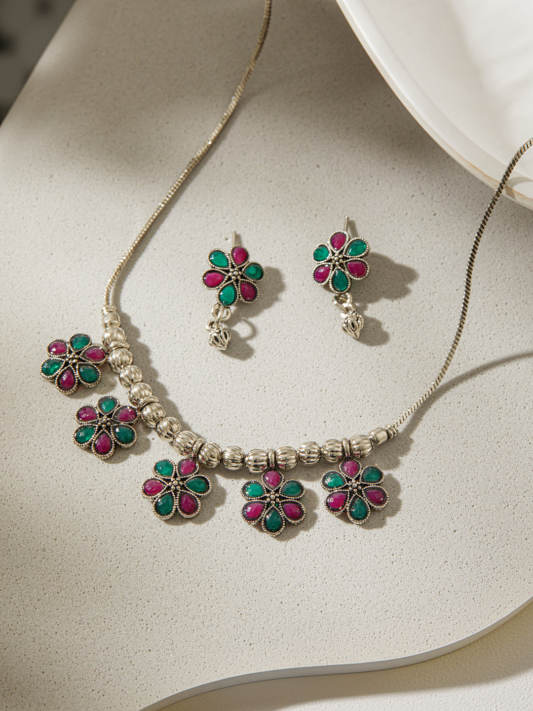 Jazz and Sizzle Silver-Plated Oxidised Stone Studded Floral Necklace & Earrings