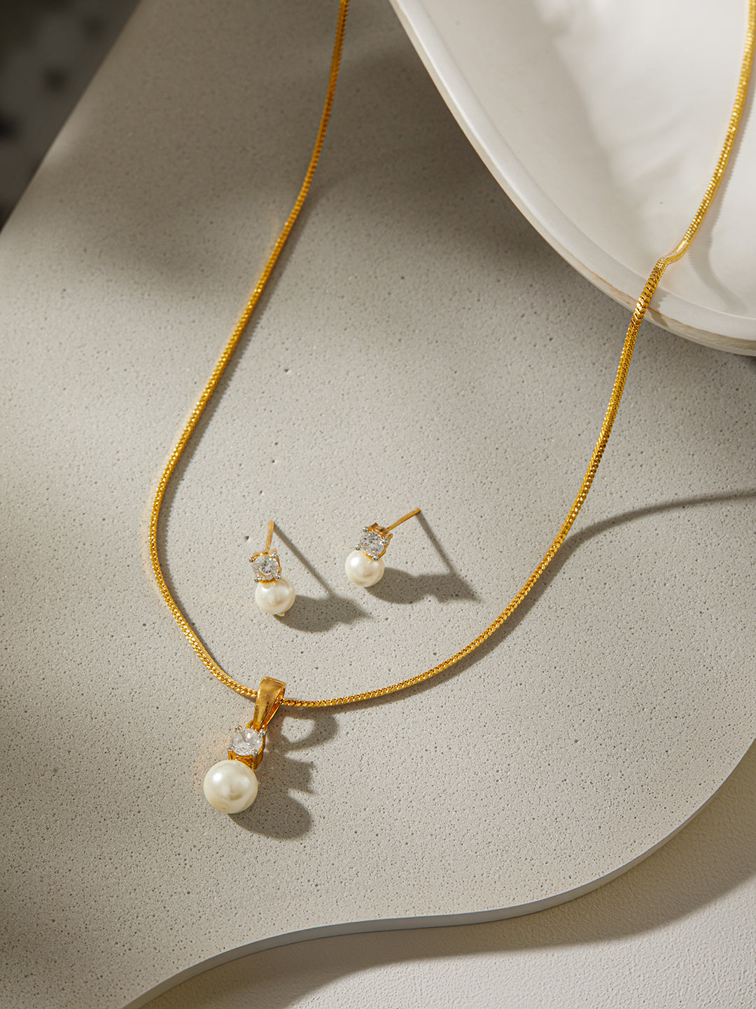 Jazz and Sizzle Gold-Plated AD Studded Pendant with Earrings and Chain