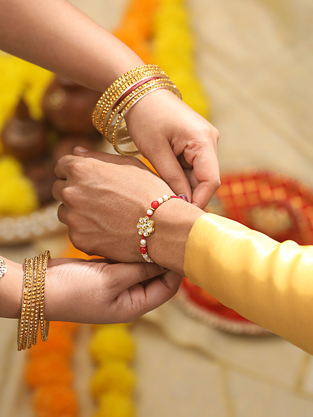 Set Of 2 Gold Toned & Kundan Studded Bhaiya & Bhabhi Rakhi With Roli & Chawal