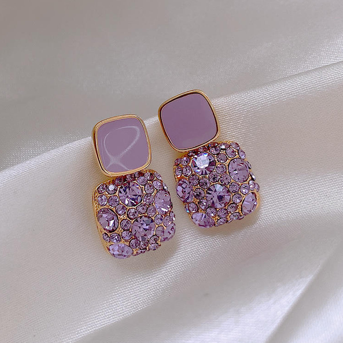 Elegant gold-tone stud earrings with rhinestones
