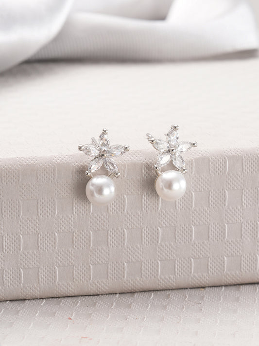 Jazz And Sizzle Rhodium Plated Floral Shaped Pearl Studded Drop Earrings