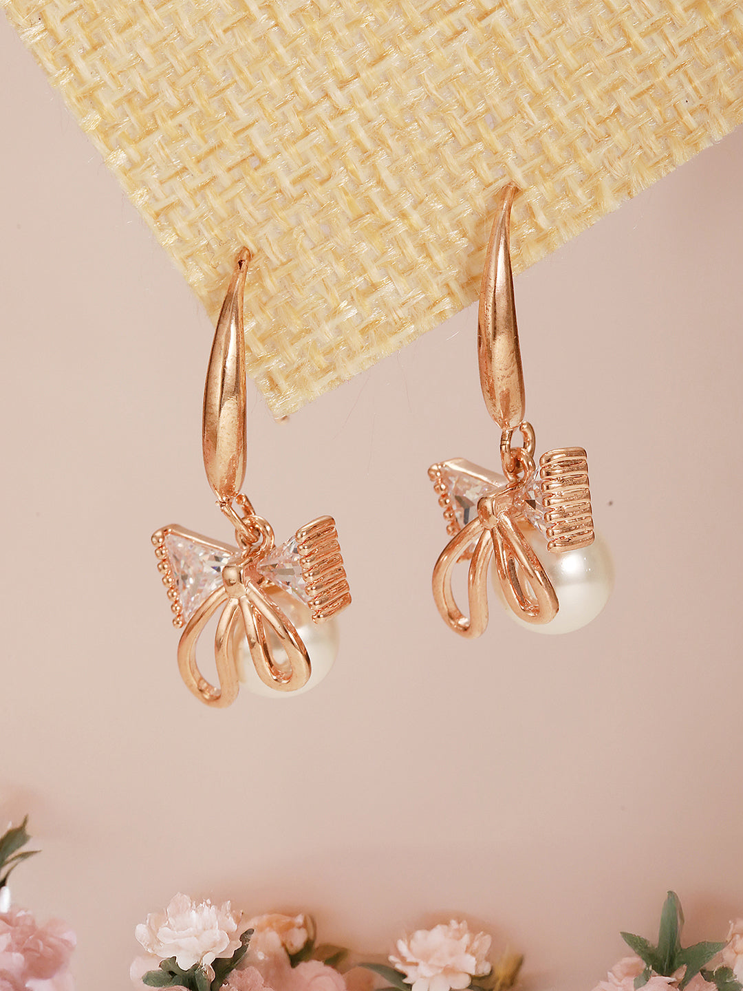Jazz And Sizzle Rose Gold-Plated Bow Shaped Pearl Studded Drop Earrings