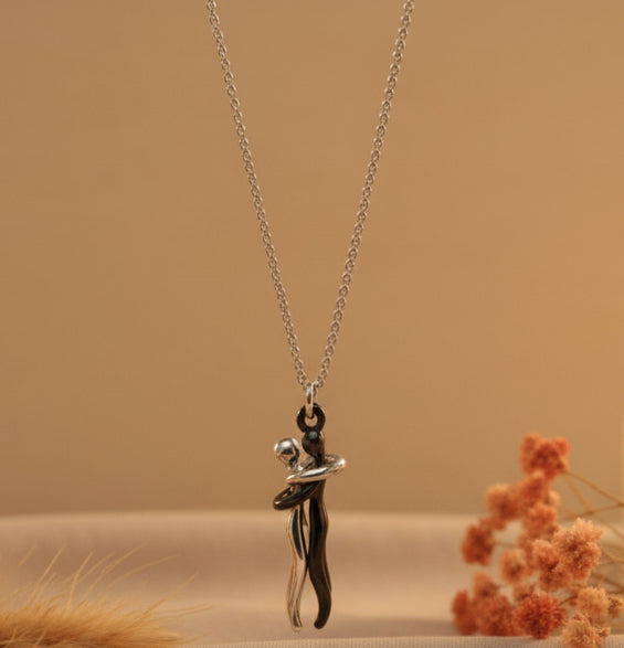 Jazz and Sizzle Silver Plated Stainless Steel Couple Hug Pendant with Chain
