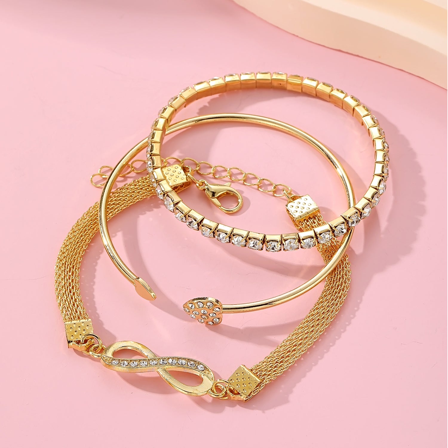 Jazz And Sizzle Set of 3 Gold Plated CZ Studded Infinity & Heart Shaped Stacking Bracelet for Valentines Gift