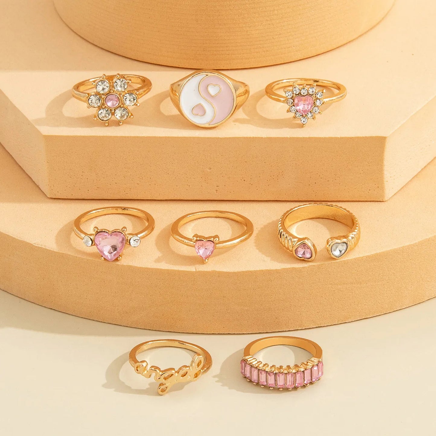 Jazz And Sizzle Set of 8 Pink Stone Studded & Gold Plated Finger Rings for Valentines Gift