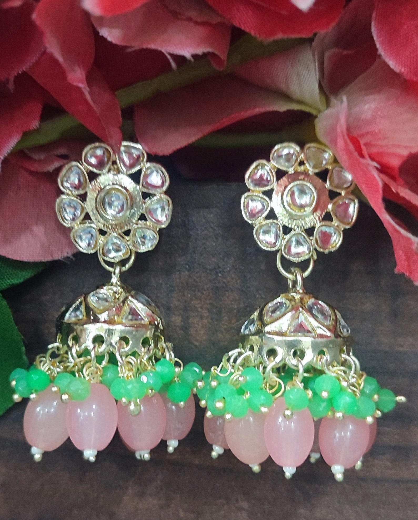 Jazz And Sizzle Gold Plated Pink &Green Pearl Beaded Kundan Studded Jhumka Earrings