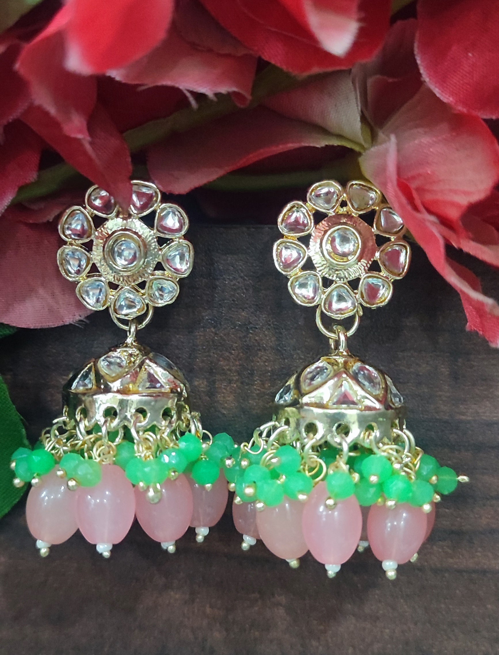 Jazz And Sizzle Gold Plated Pink &Green Pearl Beaded Kundan Studded Jhumka Earrings