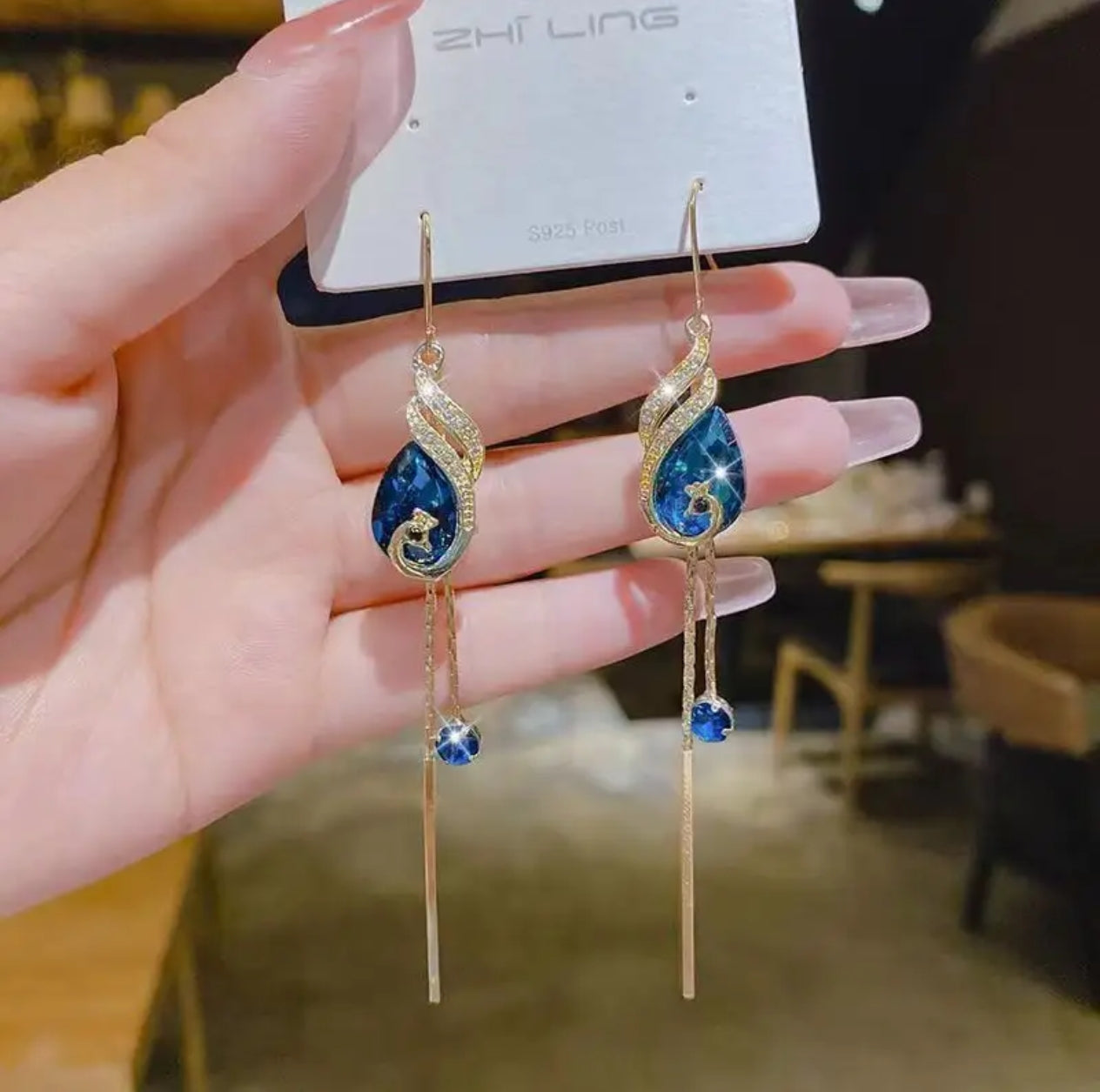 Jazz And Sizzle Gold Plated and Blue Stone Studded Long Danglers  Earrings