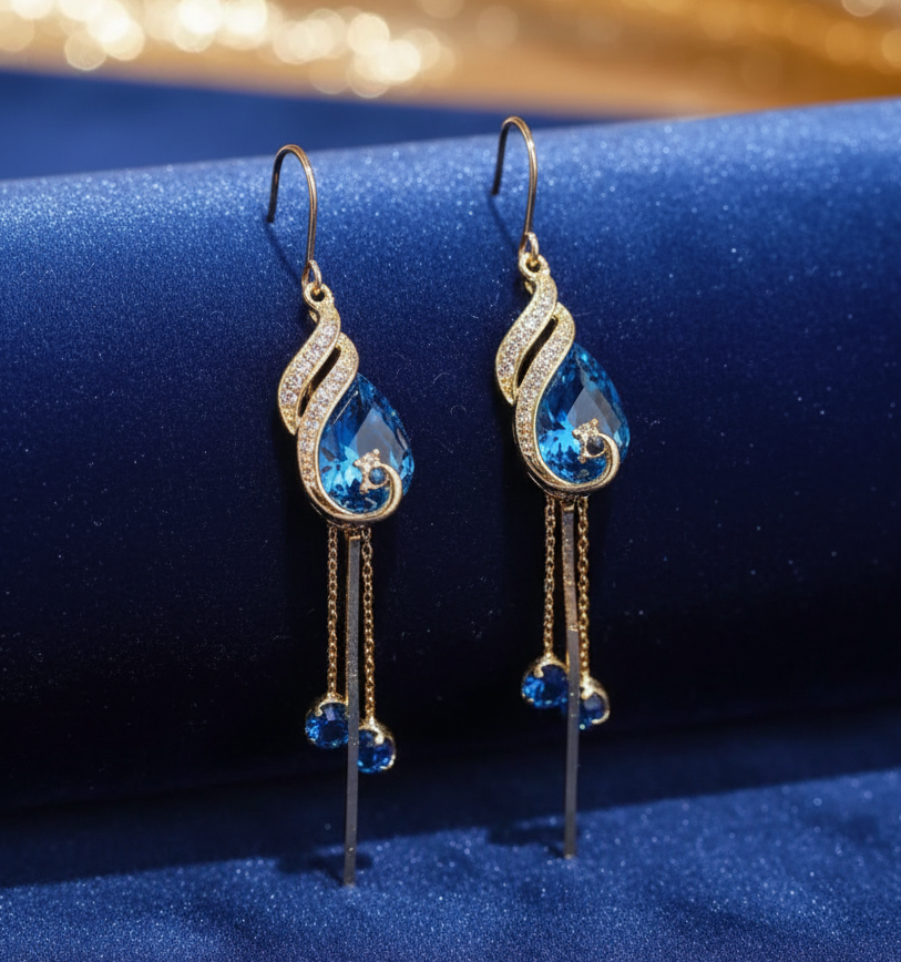 Jazz And Sizzle Gold Plated and Blue Stone Studded Long Danglers  Earrings