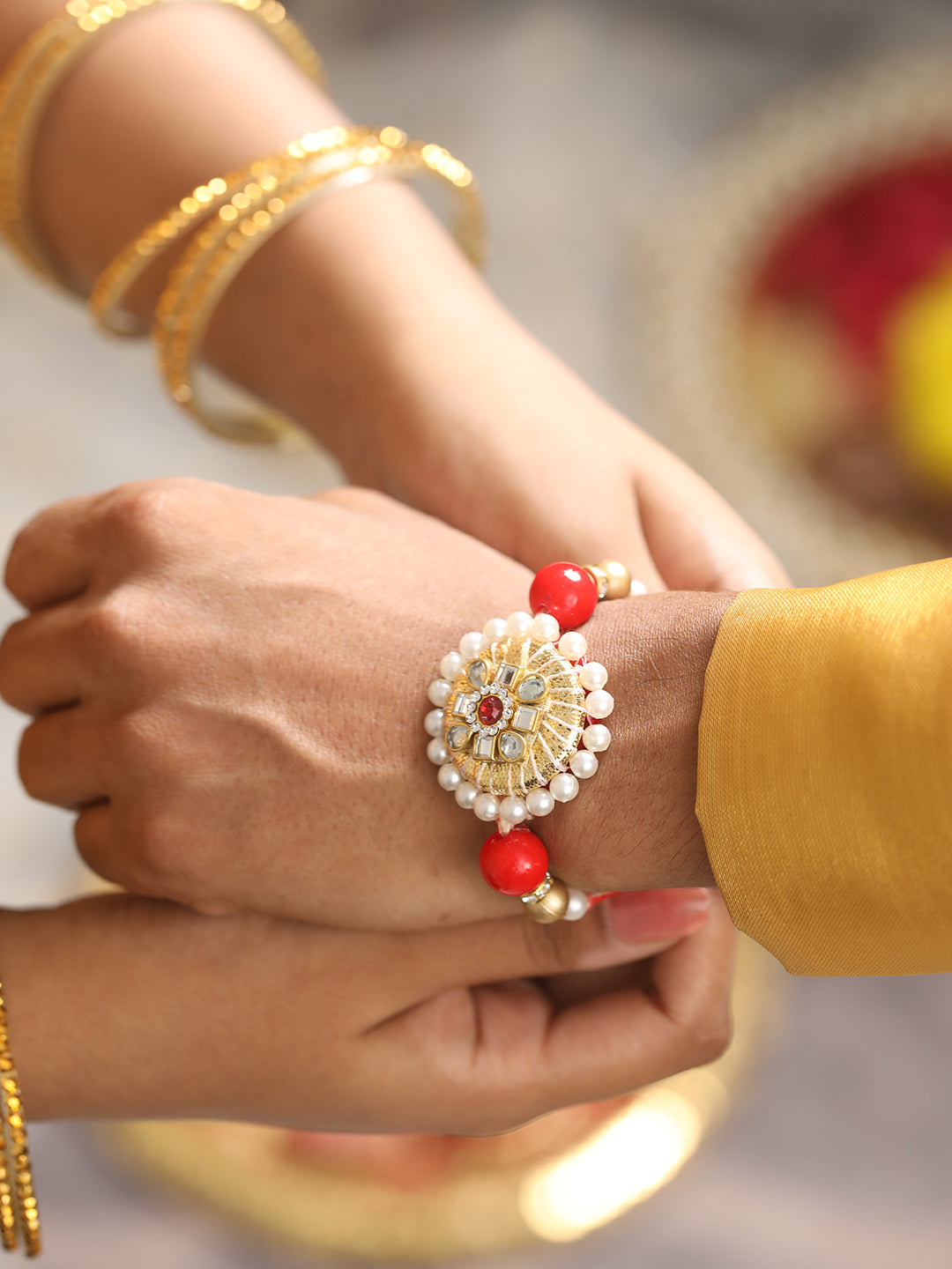 Set Of 2 Round Shaped Orange Kundan & Artificial Stone Studded Bhaiya Bhabhi Rakhi With Roli & Chawal