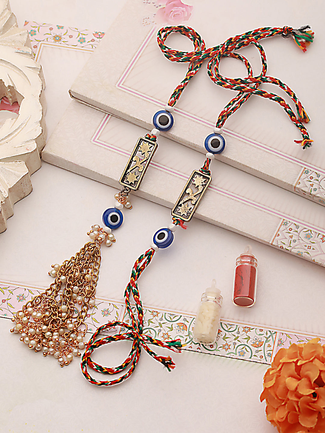 Set Of 2 Evil Eye & Floral Motif Bhaiya Bhabhi Tasseled Rakhi With Roli & Chawal