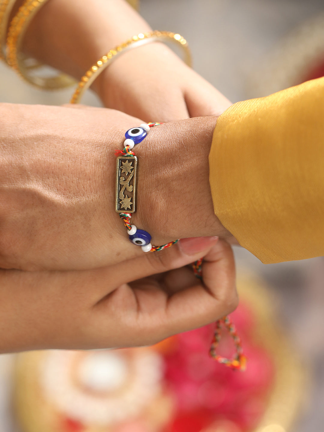 Set Of 2 Evil Eye & Floral Motif Bhaiya Bhabhi Tasseled Rakhi With Roli & Chawal