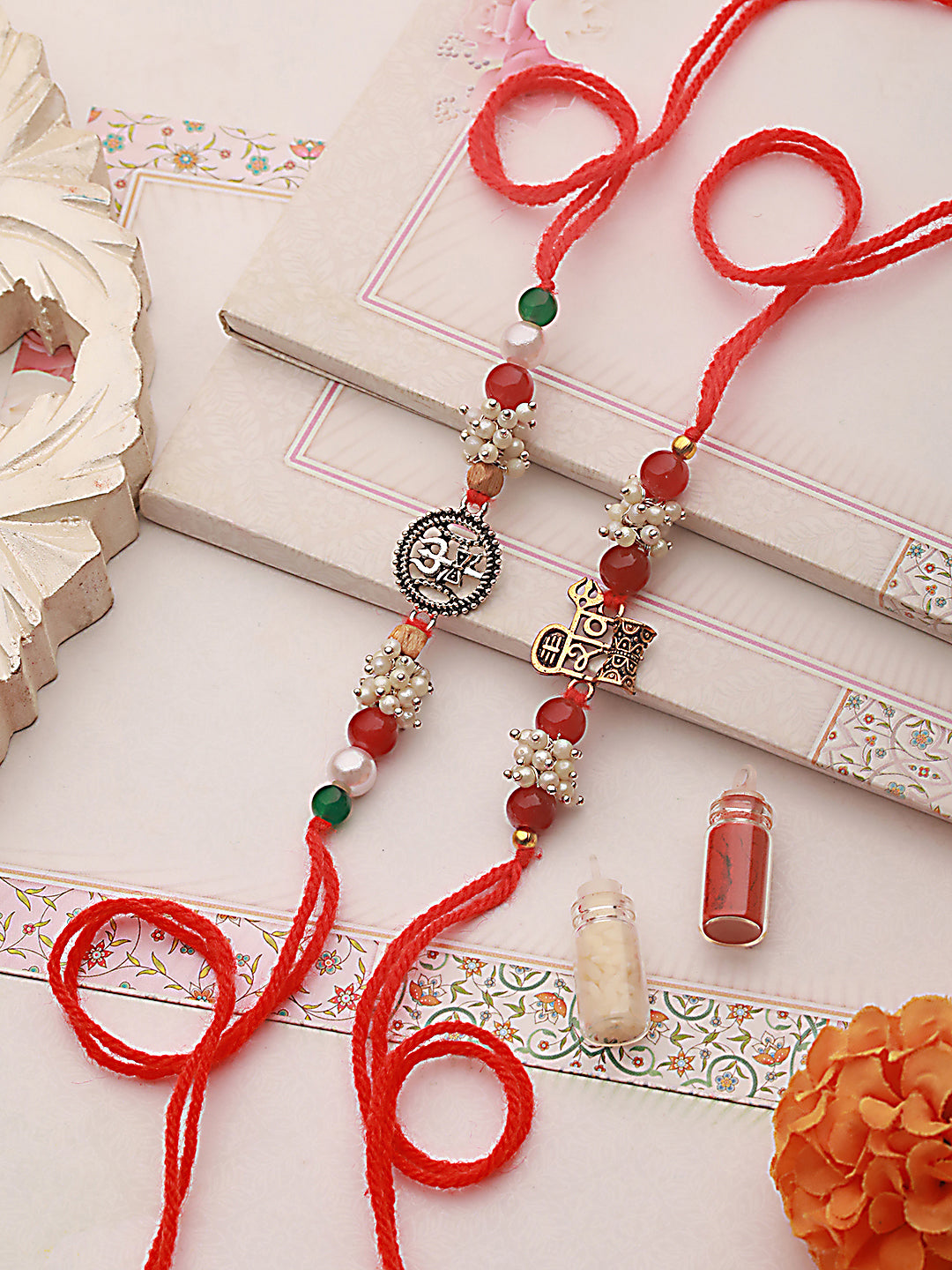 Jazz And Sizzle Set Of 2 Trishul & Shiva Dumroo Mogra Beaded Rakhi