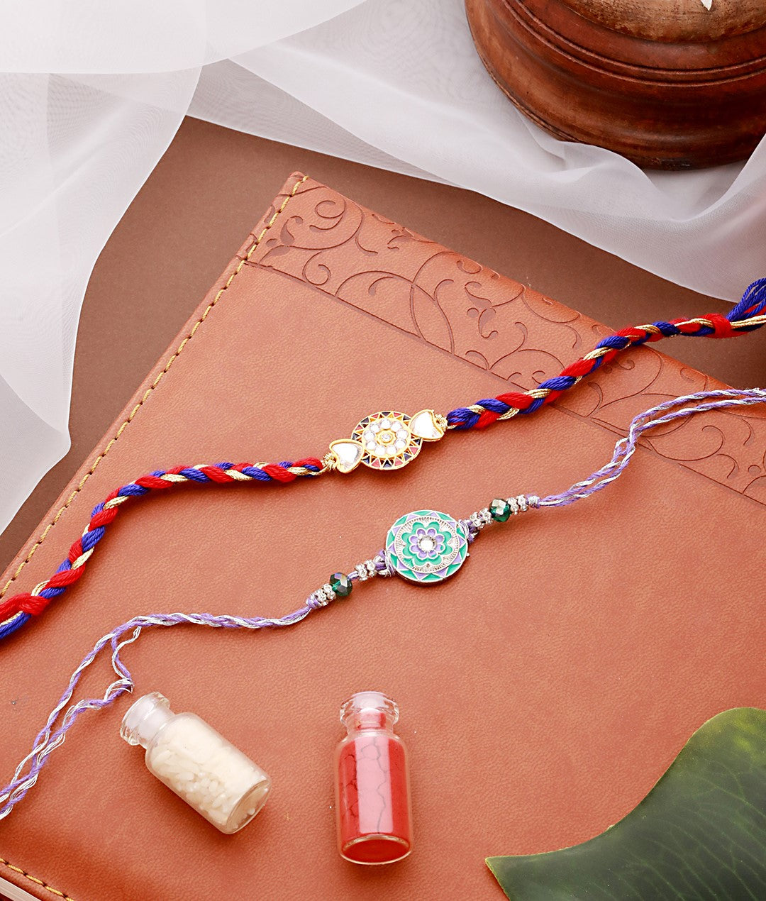 Jazz And Sizzle Set Of 2 Designer Floral Shaped And Meena Work Rakhi With Roli & Chawal