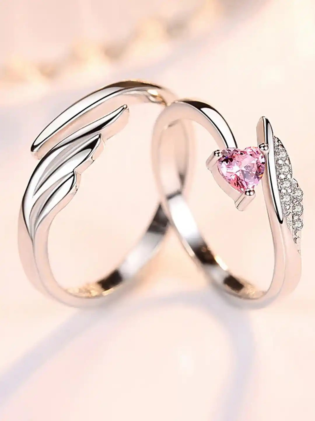 Rose gold ring with a pink gemstone on a soft background