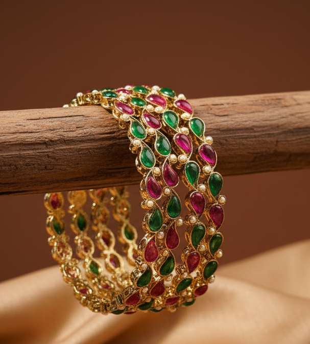 Jazz And Sizzle 4 Gold Plated Artificial Stone Studded & Pearl Beaded Bangles