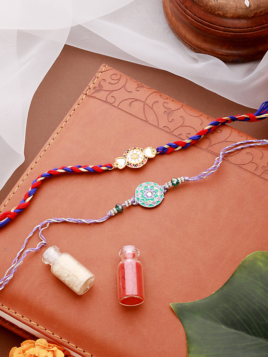 Jazz And Sizzle Set Of 2 Designer Floral Shaped And Meena Work Rakhi With Roli & Chawal