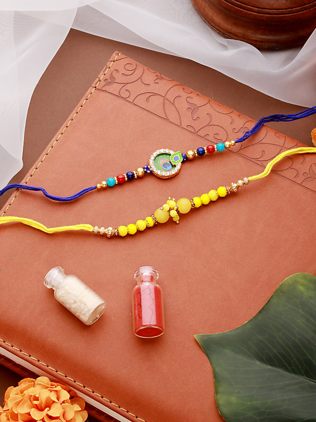 Jazz And Sizzle Set Of 2 Yellow Pearl Beaded & Blue Morpankh Enameled Designer Rakhi