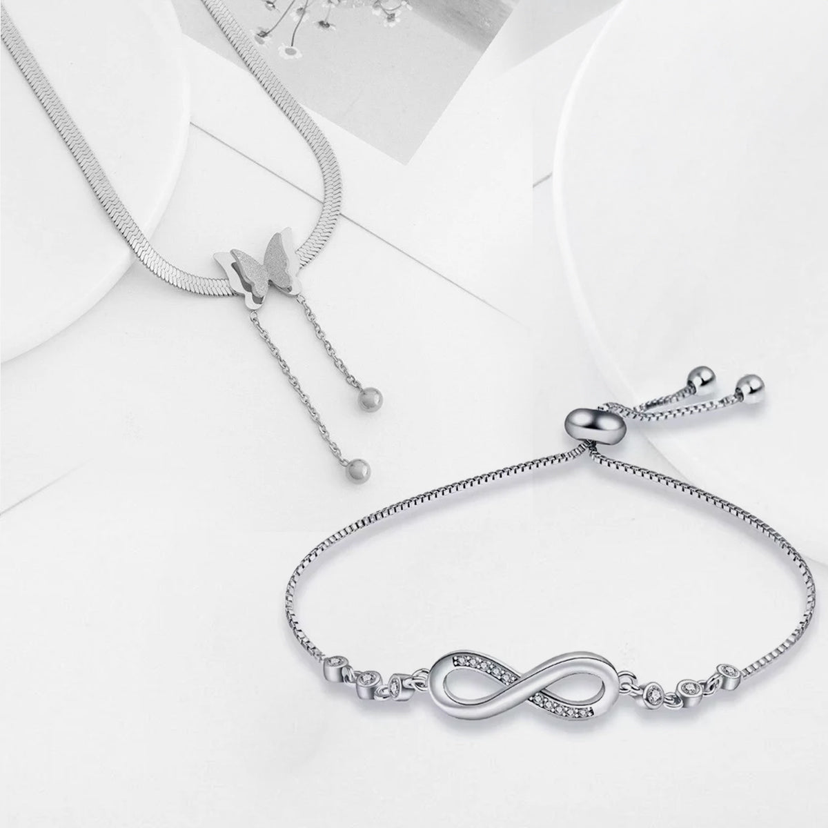 Jazz And Sizzle Sterling silver butterfly pendant and infinity bracelet