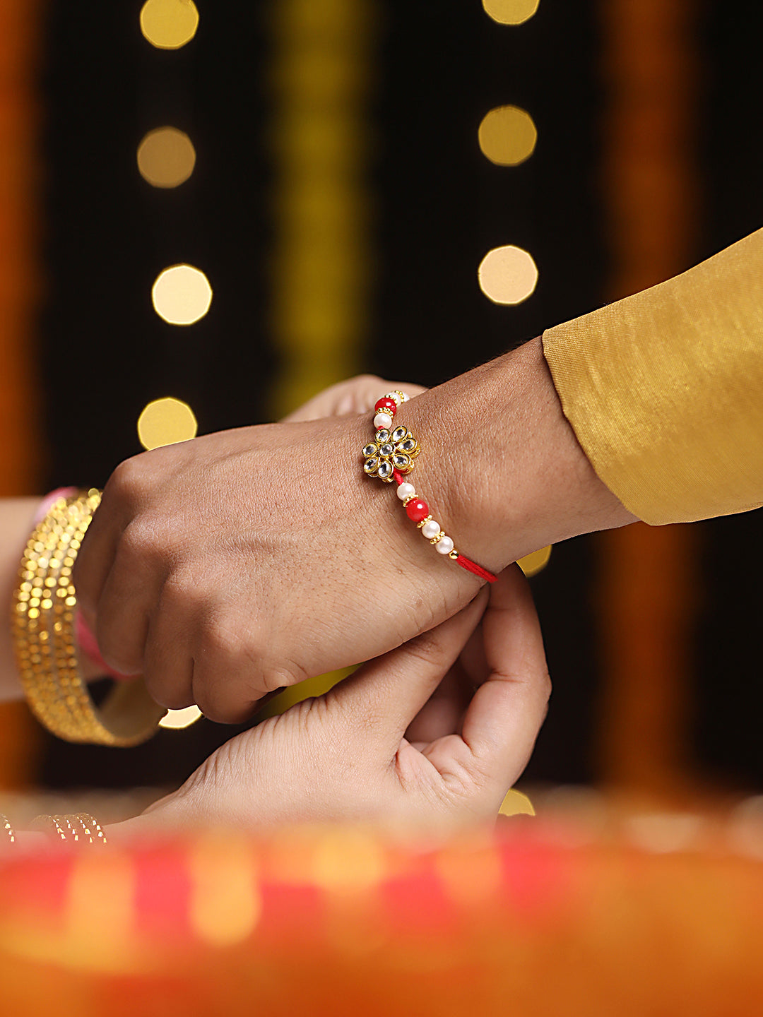 Set Of 2 Gold Toned & Kundan Studded Bhaiya & Bhabhi Rakhi With Roli & Chawal