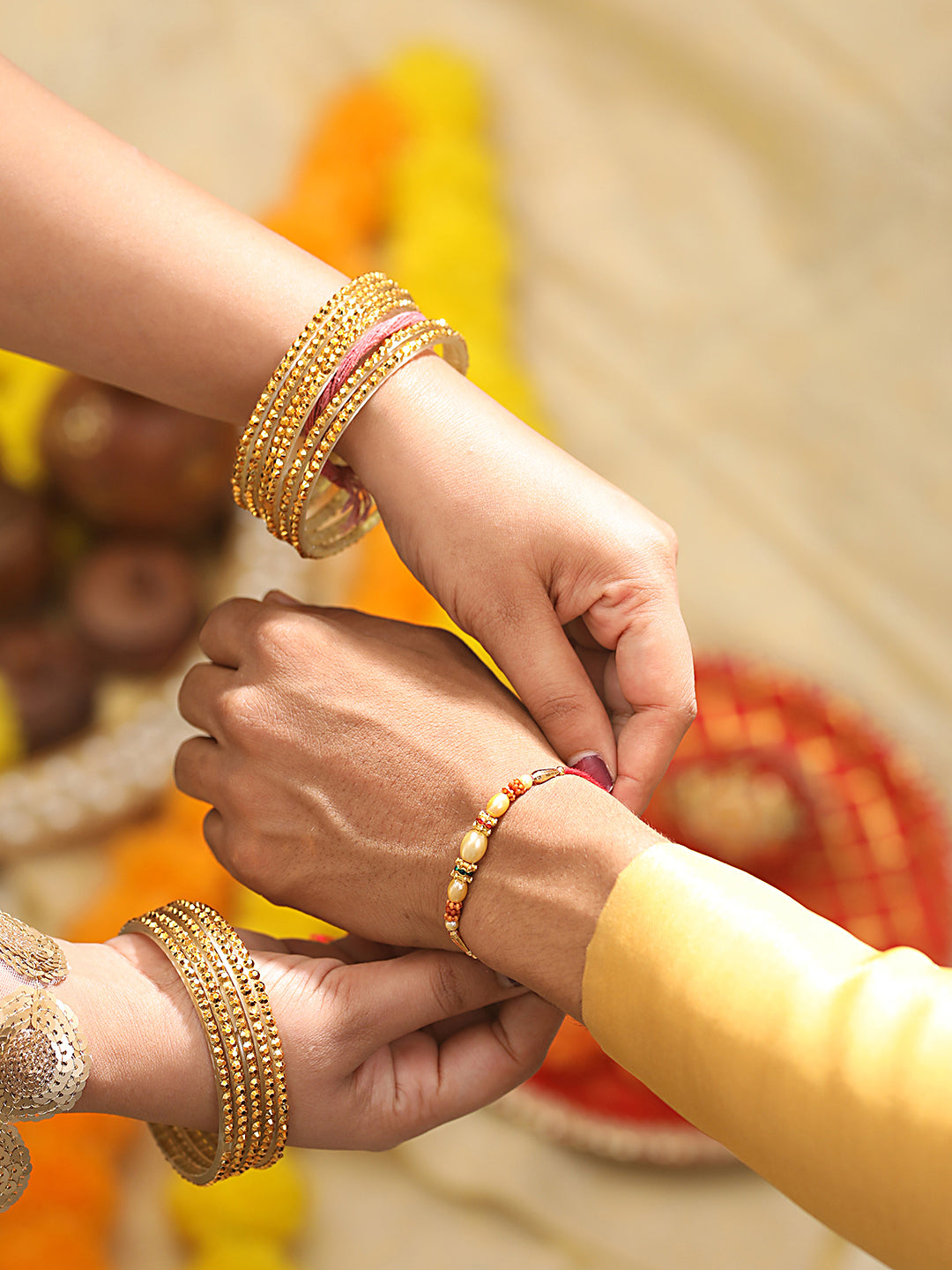 Jazz And Sizzle Set Of 2 Trishul Enameled & Faux Pearl Beaded Rakhi With Roli Chawal